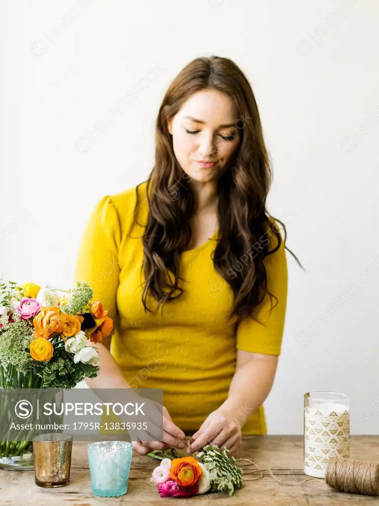 Woman preparing bouquet of flowers