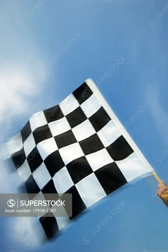 Hand waving checkered flag