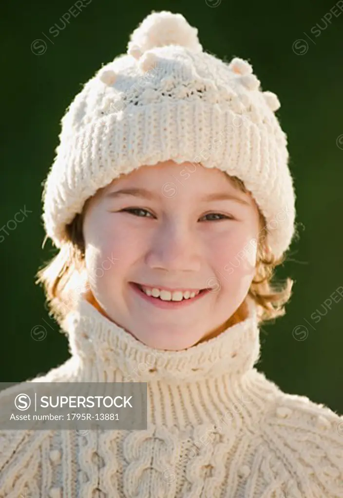 Boy wearing hat and sweater