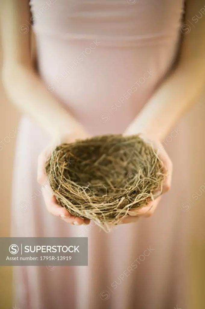 Woman holding bird's nest