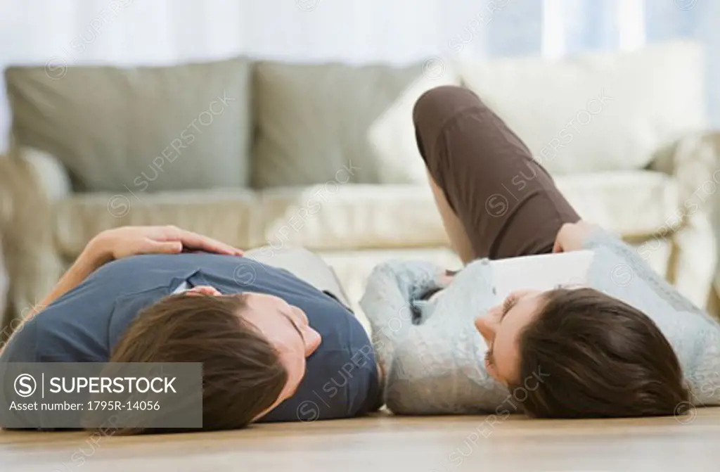 Couple laying on floor