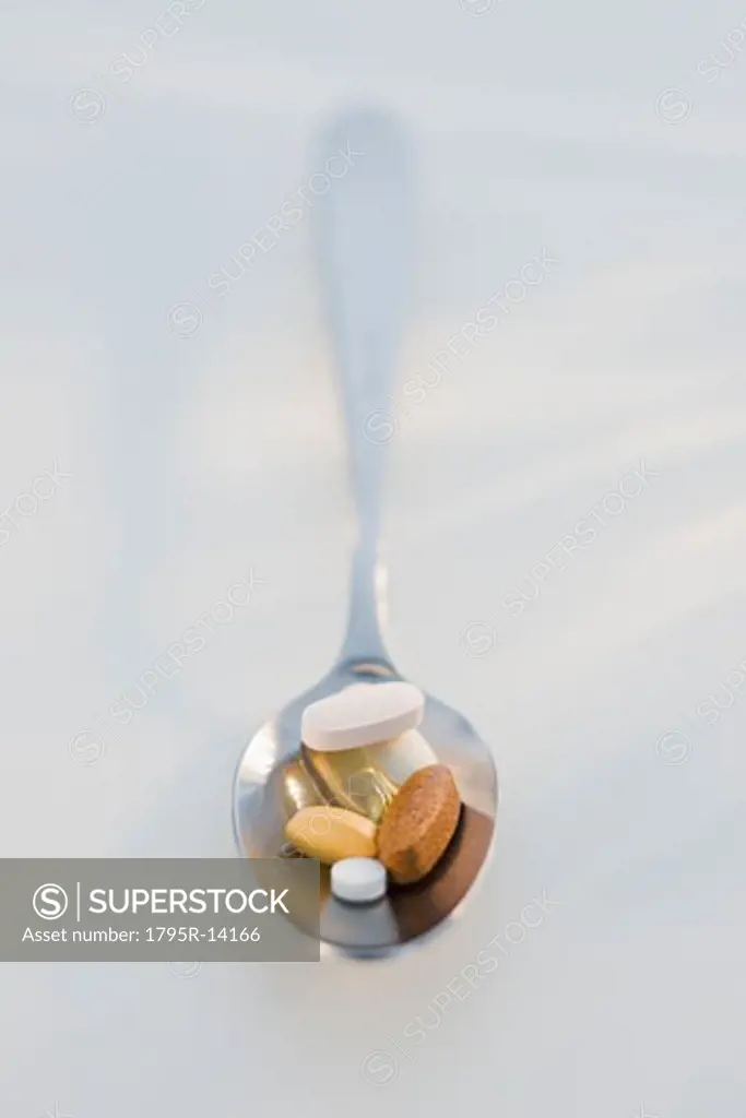 Close-up of vitamins on spoon