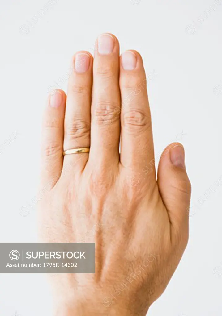 Close-up of man's hand wearing wedding ring