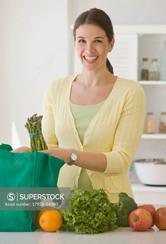 Woman unpacking groceries