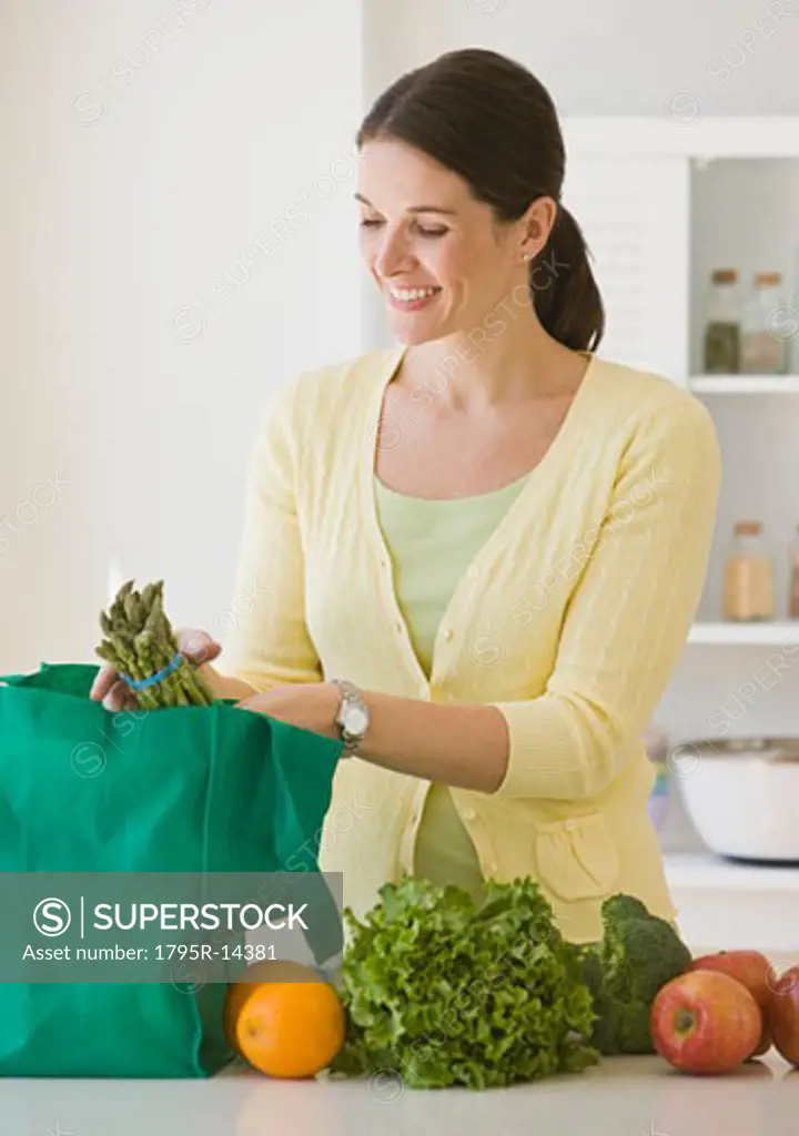 Woman unpacking groceries