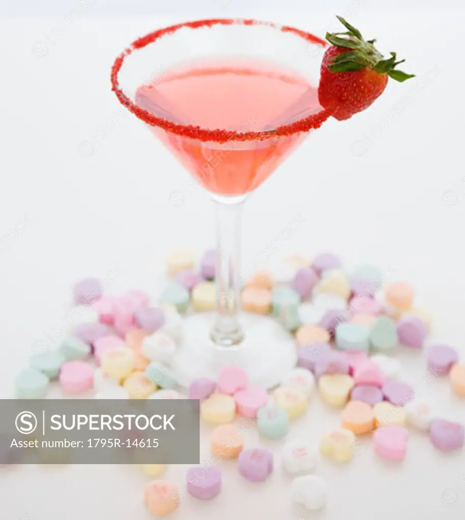 Cocktail surrounded by candy hearts