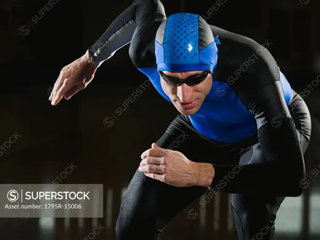 Male speed skater in ready position