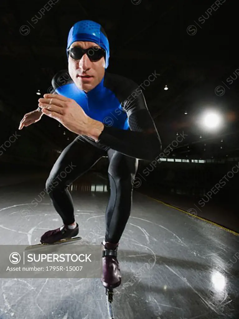 Male speed skater on ice