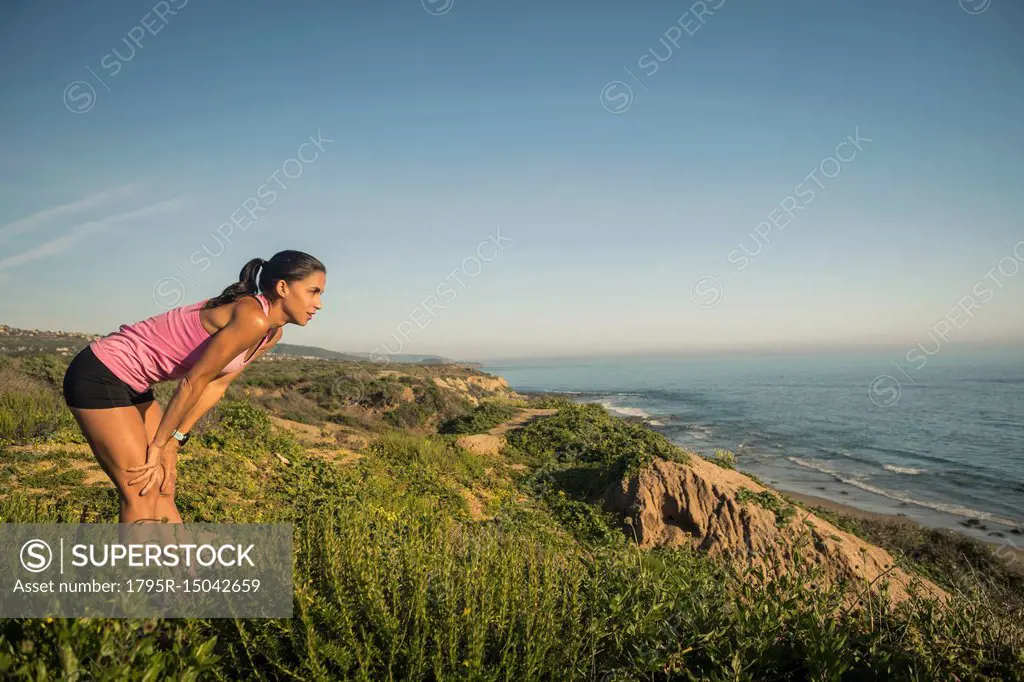 USA, California, Newport Beach, Woman resting and looking at sea