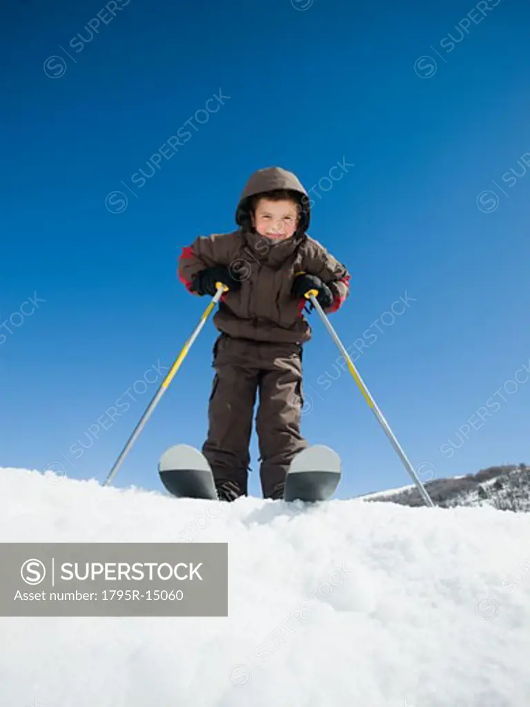 Boy standing on skis