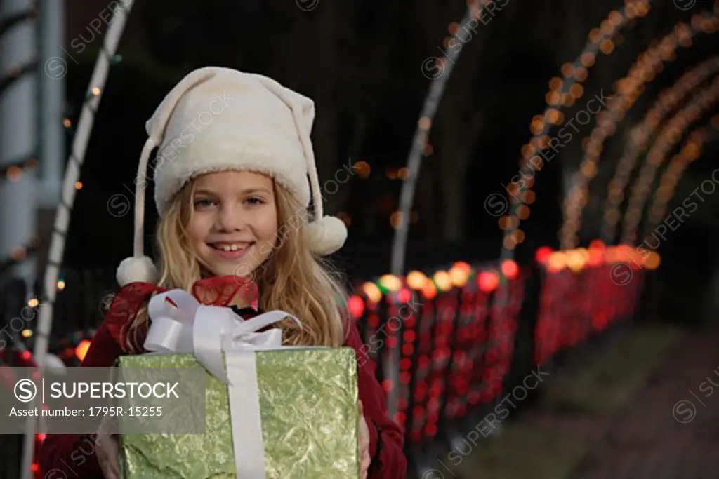 Girl holding Christmas gift
