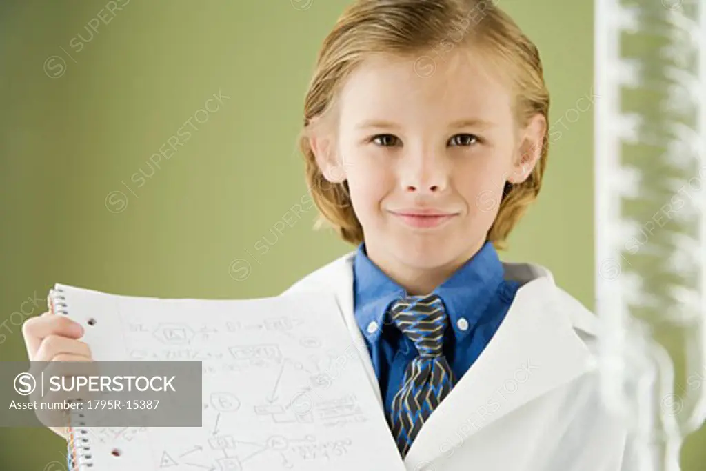 Boy holding science notebook