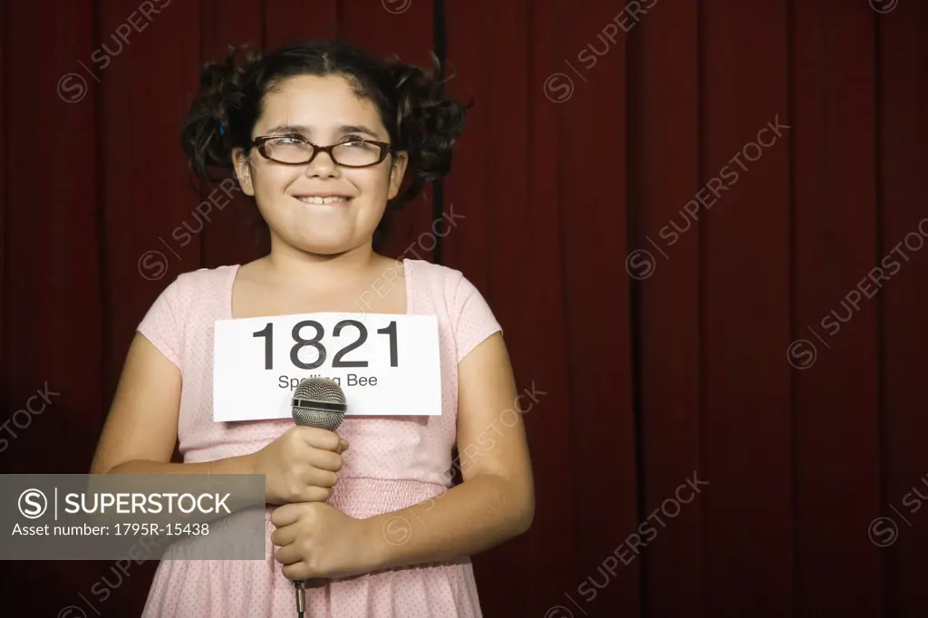 Girl wearing number on stage