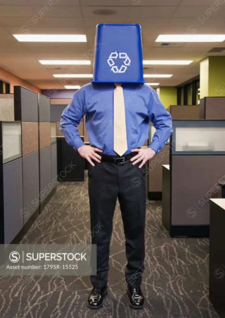 Businessman with recycling bin on head