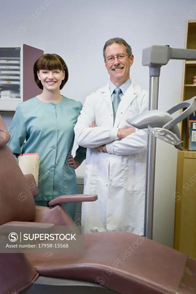 Dentist and dental hygienist in office
