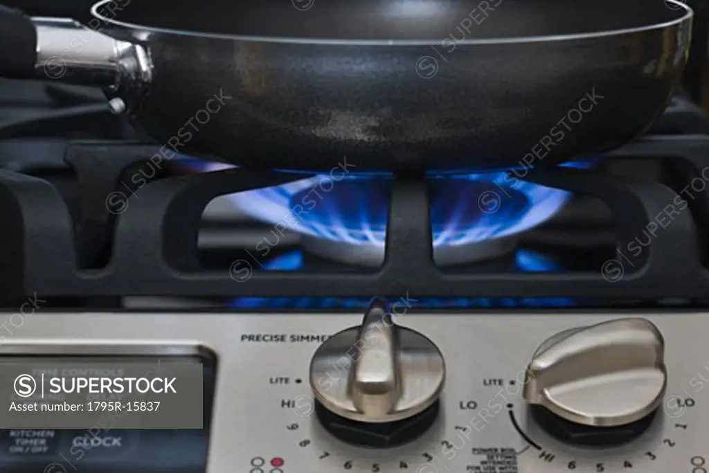 Close-up of skillet on gas stove