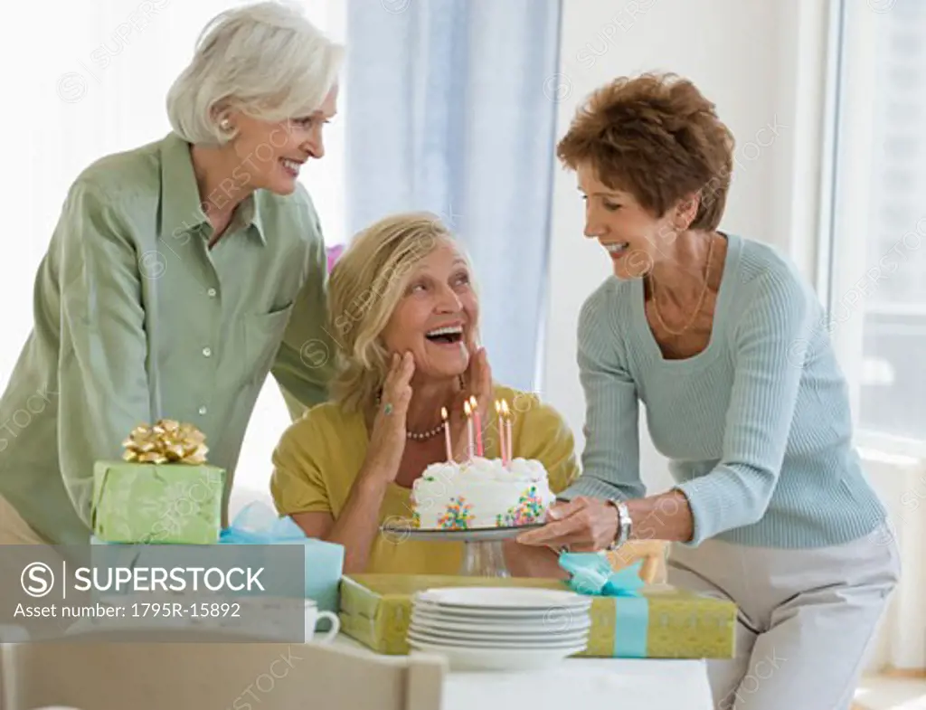 Senior women celebrating friend's birthday
