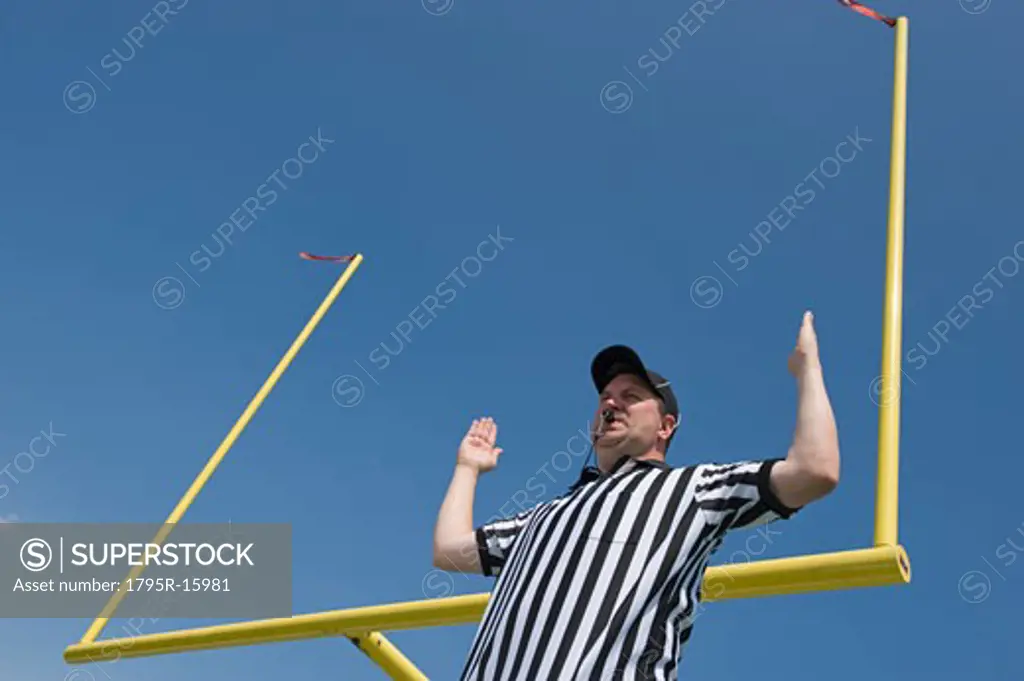 Football referee calling field goal