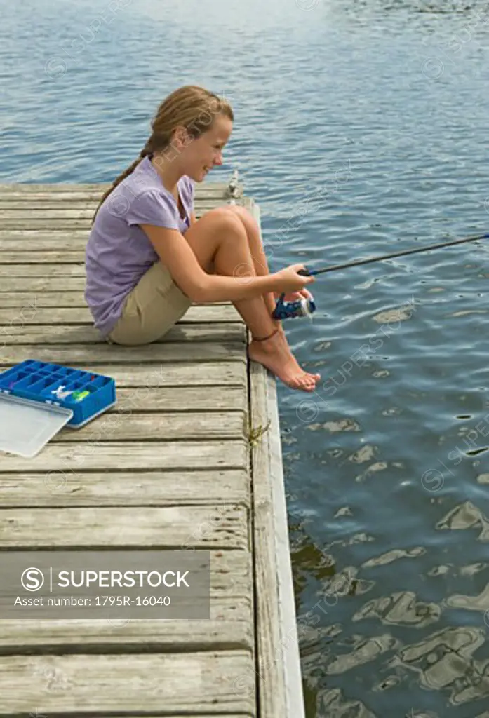 Girl fishing off dock