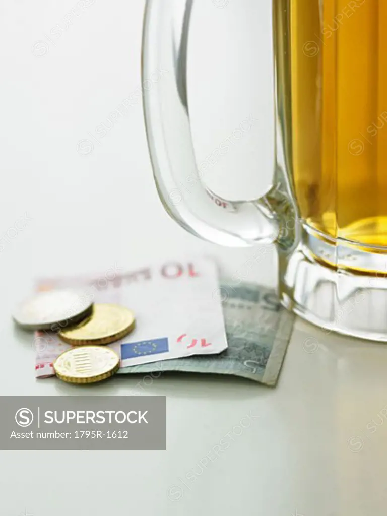 Beer mug and currency