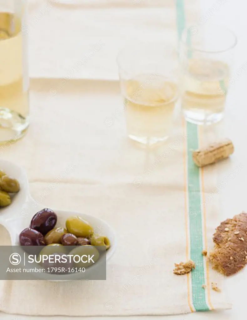 Glasses of white wine and olives