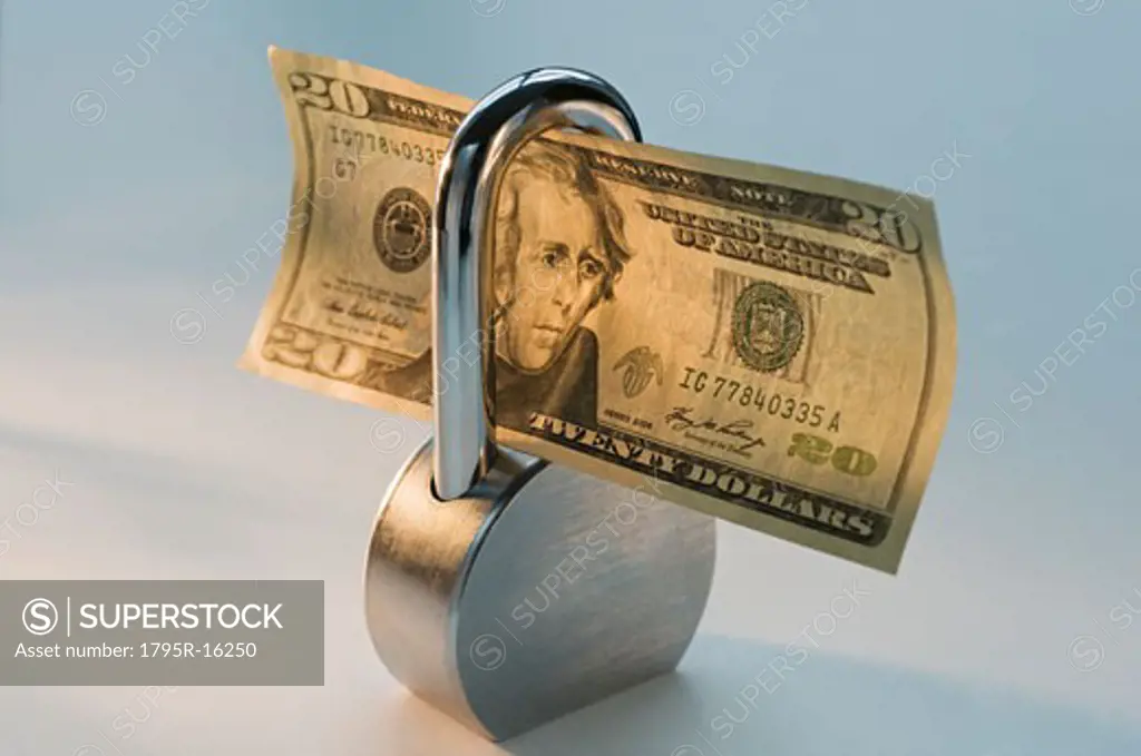 Close-up lock and dollar bill