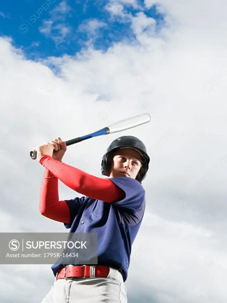 Baseball player reading to swing bat