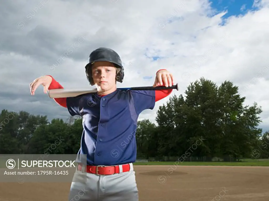 Baseball player posing with bat