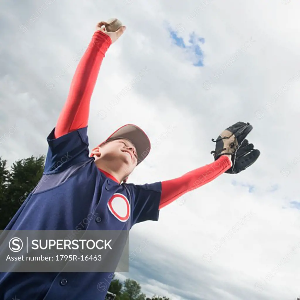 Baseball player celebrating with arms raised