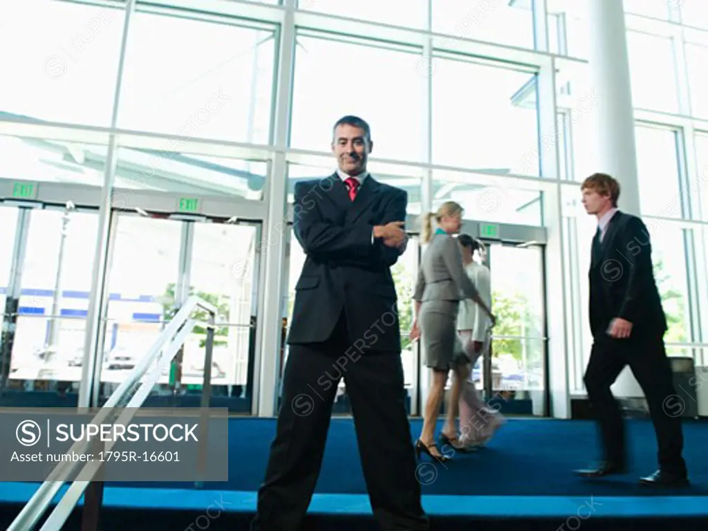Confident businessman posing in lobby
