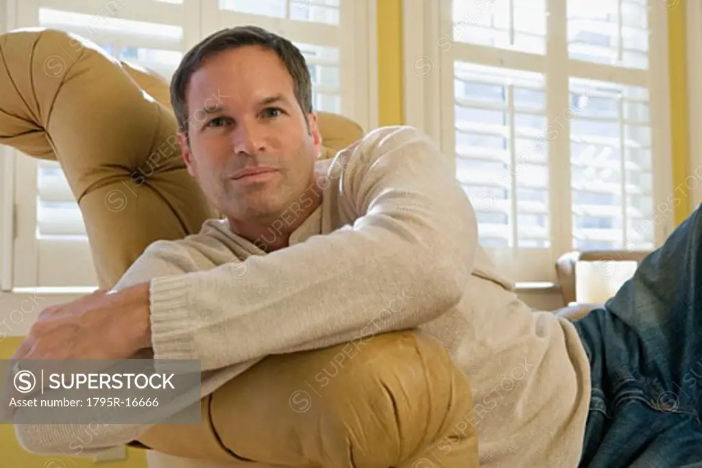 Man relaxing in arm chair