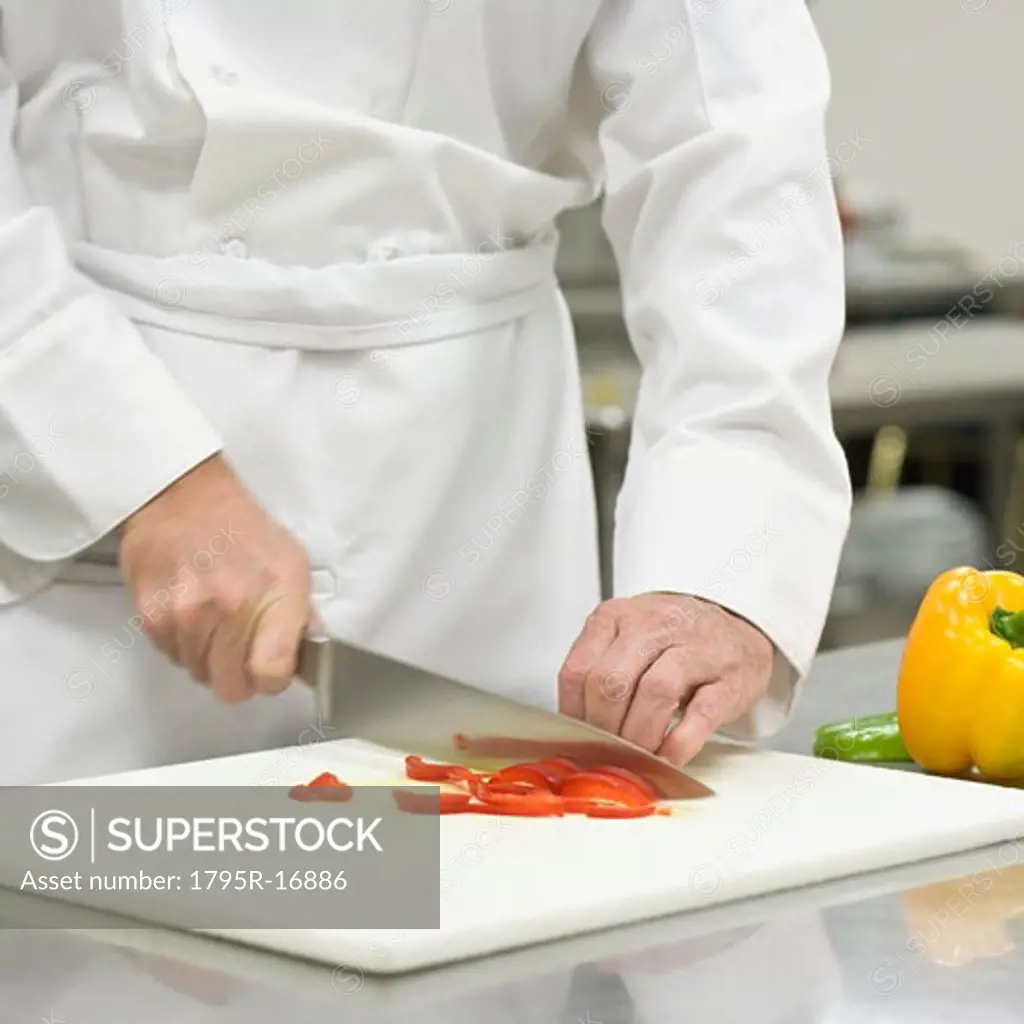 Chef chopping bell peppers