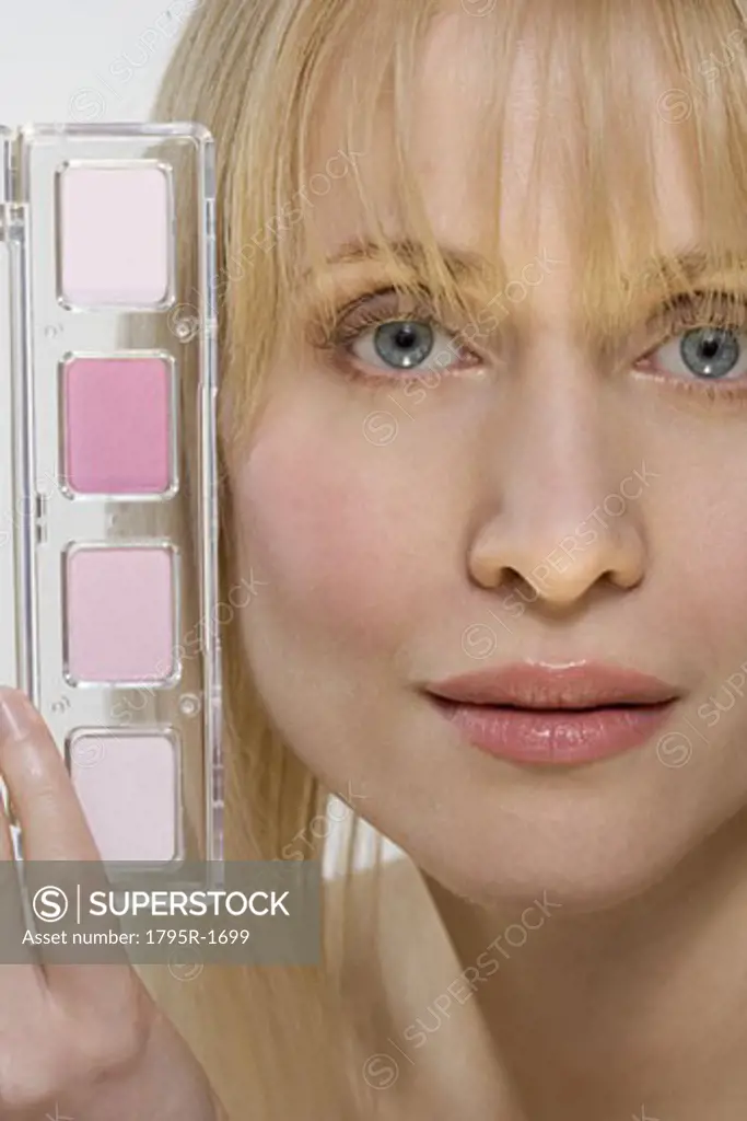 Woman's face with pink cosmetics