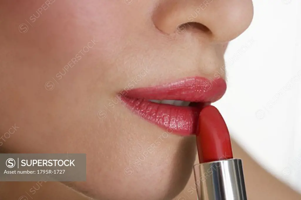 Closeup of mouth with red lipstick