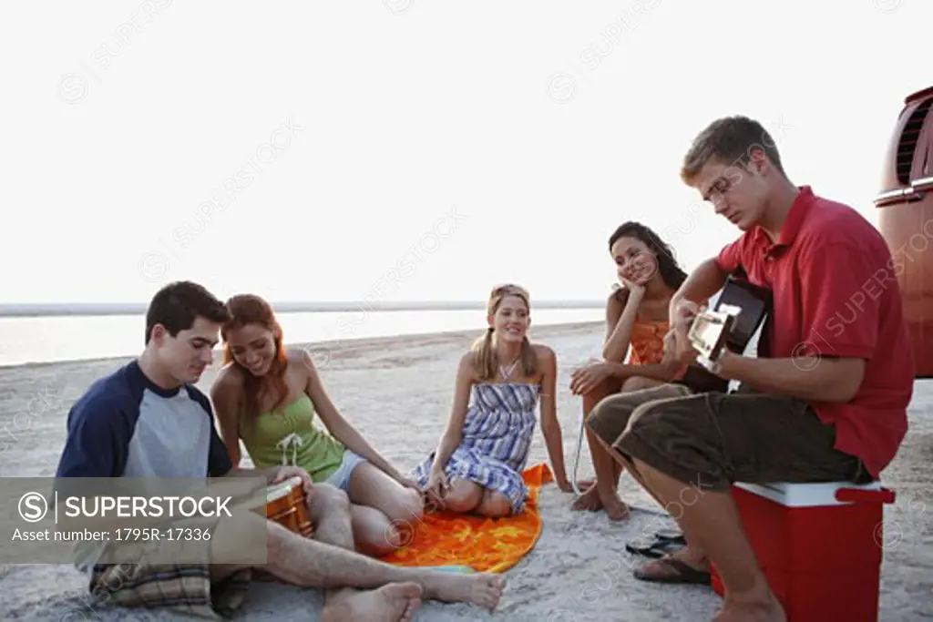 Friends socializing on beach