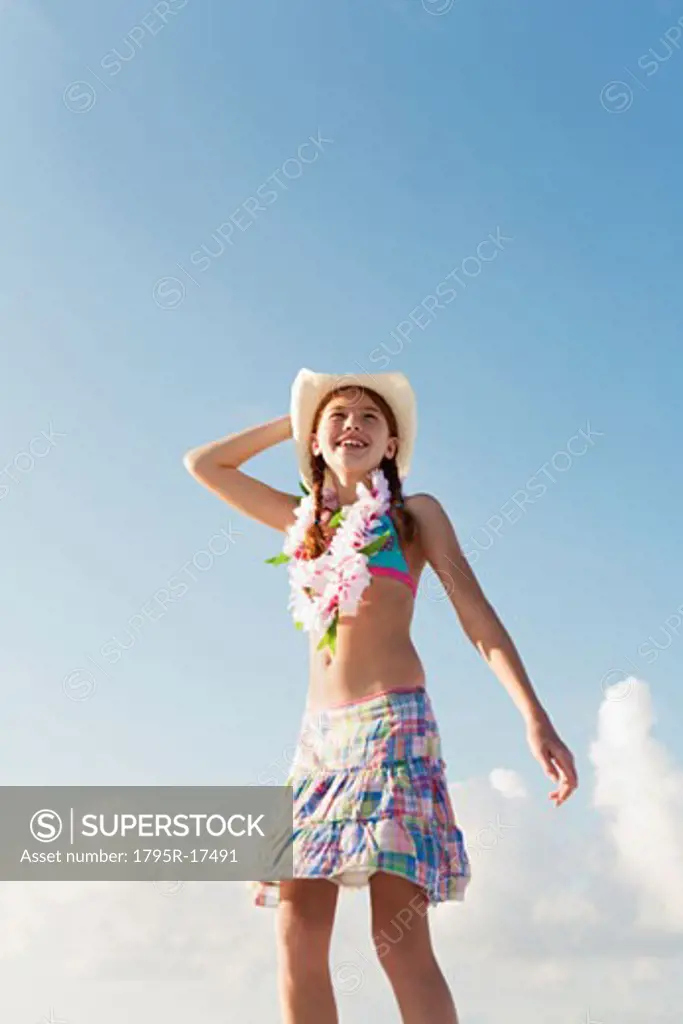 Girl in bathing suit with lei around neck