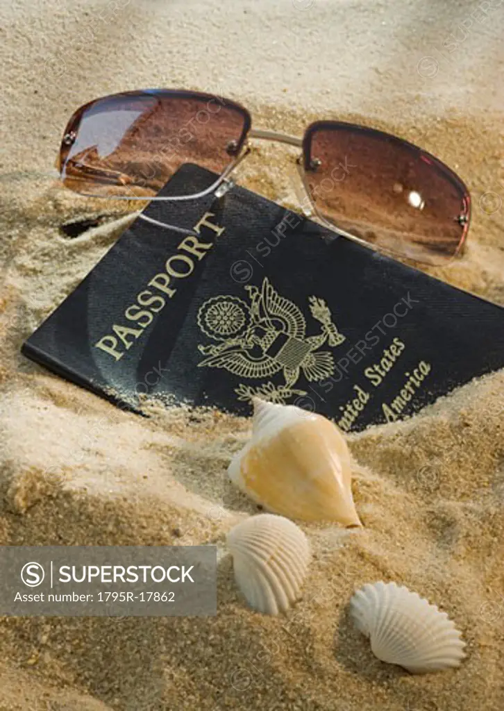 United States passport, sunglasses, and seashells