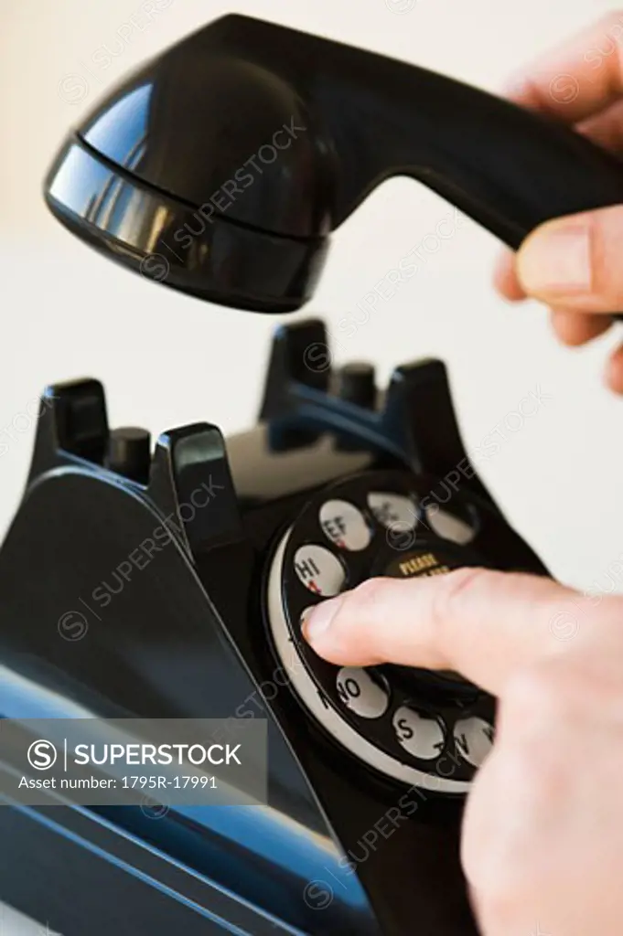 Hand dialing rotary telephone