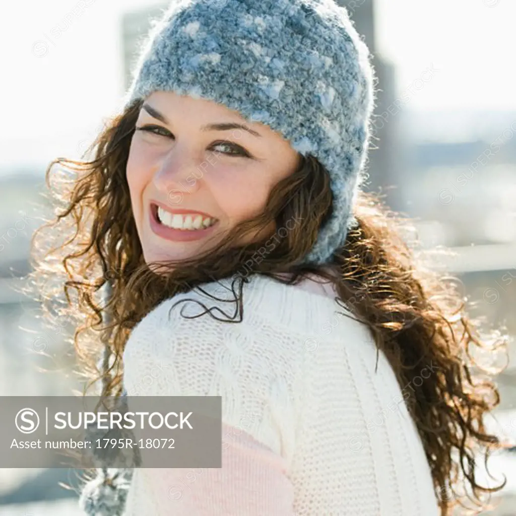 Portrait of woman smiling in stocking cap
