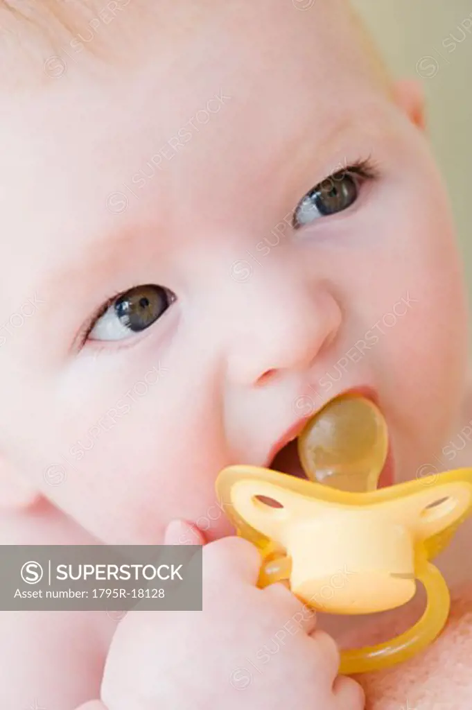 Close-up of baby with pacifier