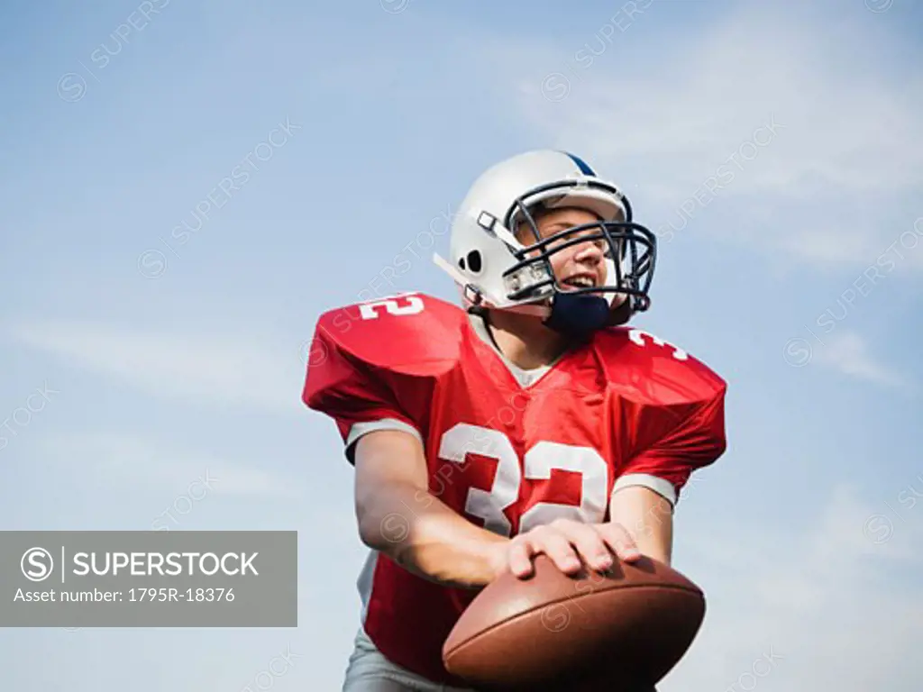 Quarterback holding football