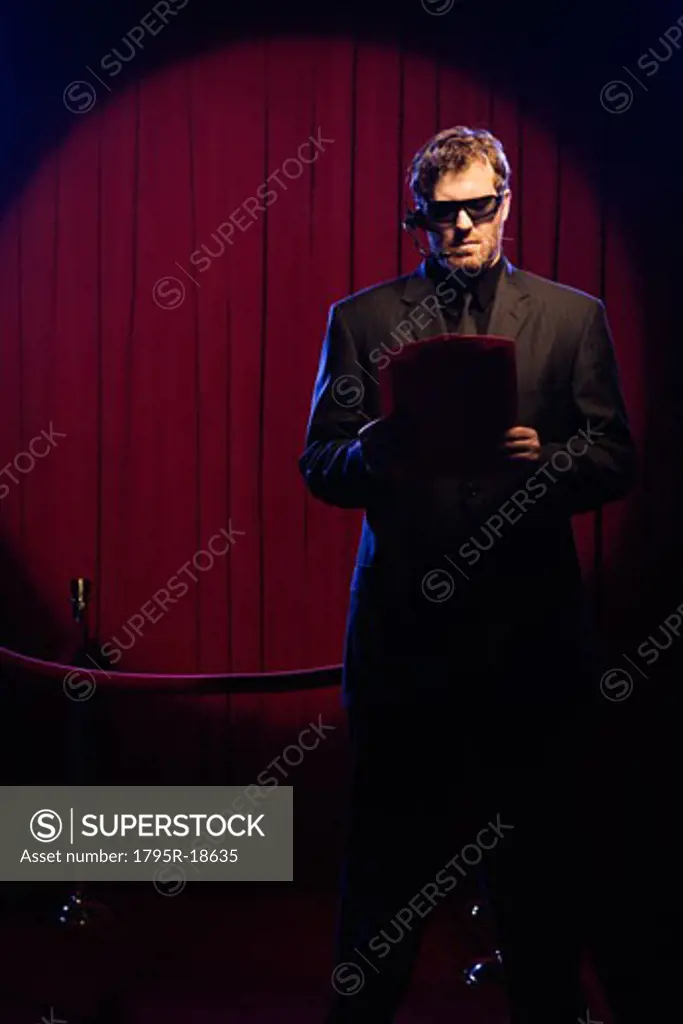 Bouncer looking at guest list