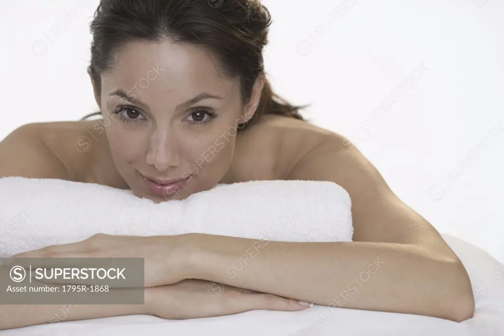Woman with towel smiling seductively