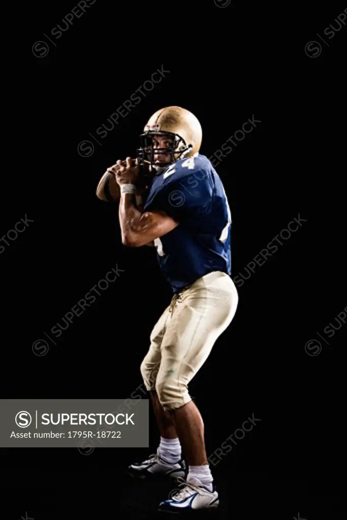 Quarterback preparing to throw football
