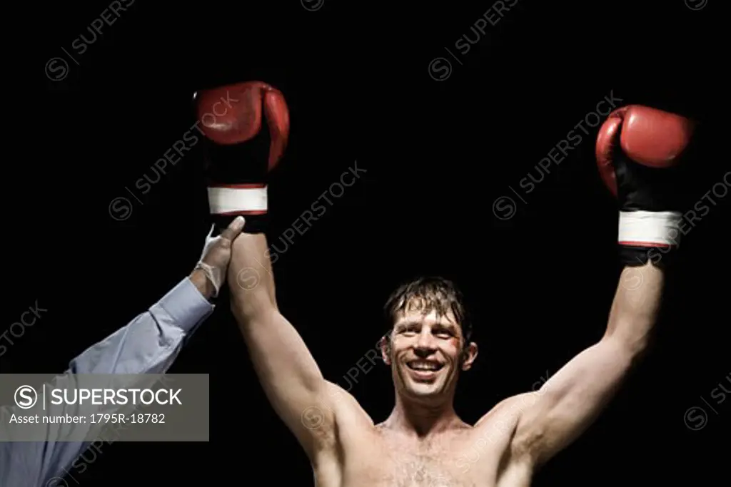 Boxer with arms raised