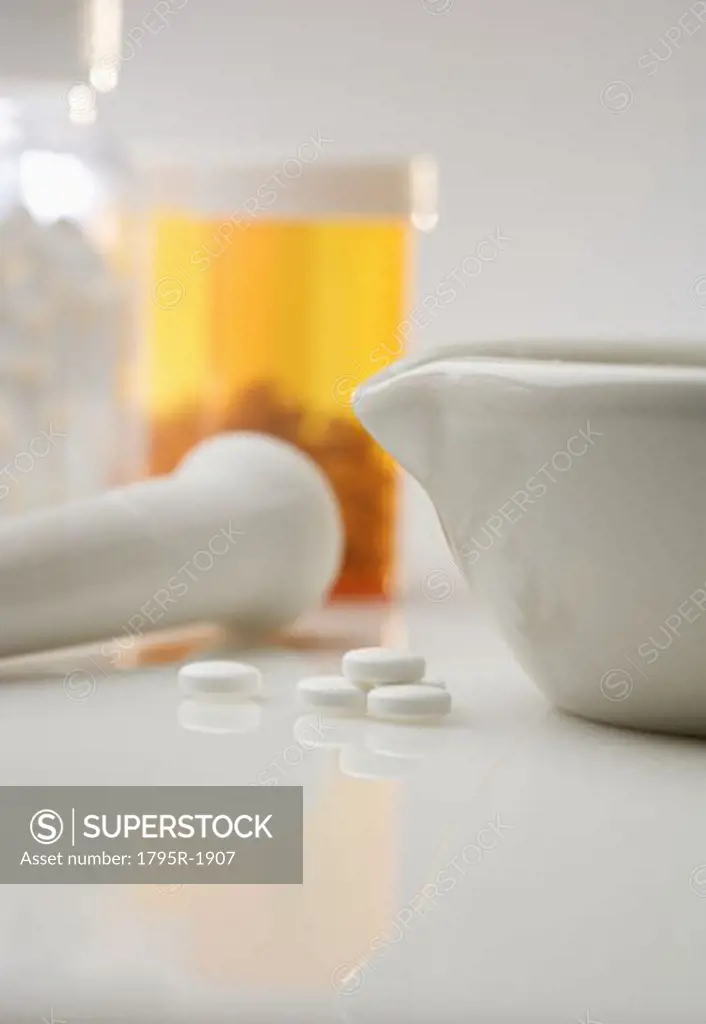 Pill bottles with mortar and pestle