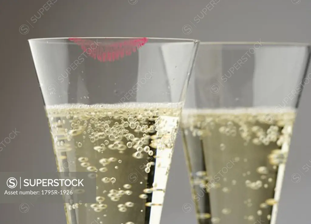 Closeup of champagne with lipstick print