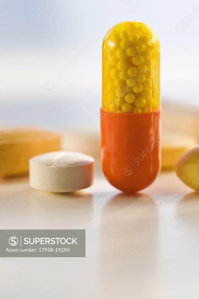 Close-up of medicine capsule and pills