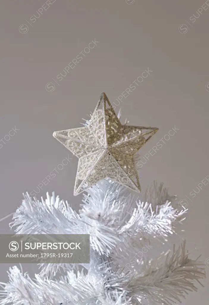 Star on artificial Christmas tree