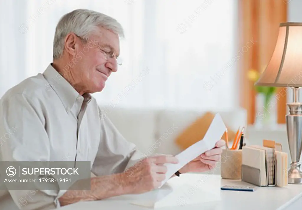 Senior man reading letter